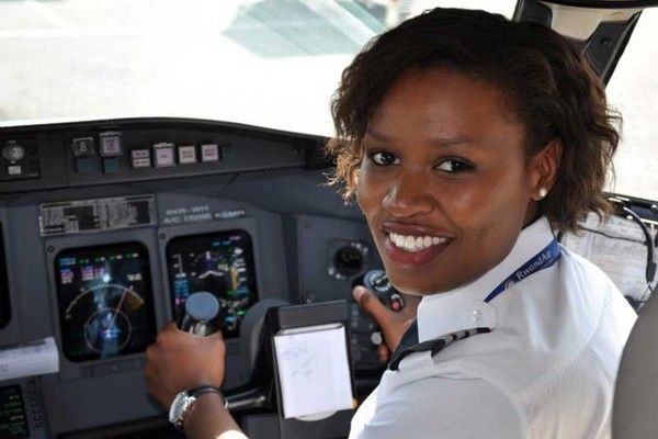 Photo of Adeola Sowemimo in the cockpit of a plane.