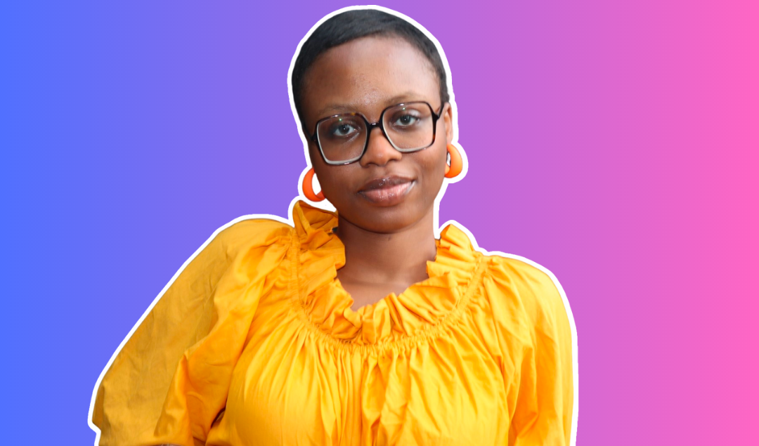 Ifeoma Igwe, a Black woman with short hair and glasses wearing and yellow top